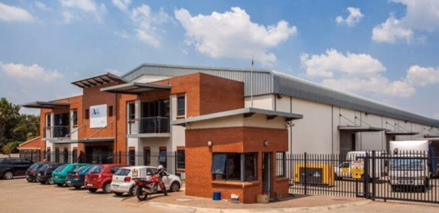 Spacious industrial storage warehouse showing prime logistical space and concrete flooring